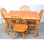 A retro pine tile topped dining table on ring turned legs,