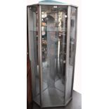 A triple sided glass display unit, height 150cm.