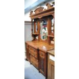 A large reproduction light oak dresser,