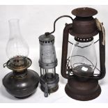 A Thomas Williams of Abadare miners lamp, an oil lamp marked "Beacon" and a brass paraffin lamp (3).