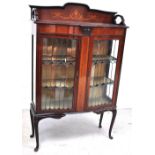 A late 19th early 20th century mahogany and inlaid display cabinet, two glazed doors with Art