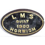 An original locomotive works plate "LMS built 1900 Horwich" presented on a wooden base, length 26cm.