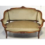 An Edwardian small walnut salon sofa upholstered in pale green velvet, length 120cm.