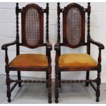 Two Edwardian cane backed elbow chairs with barley twist supports (2).