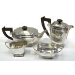 A George VI hallmarked silver four piece tea service to include tea pot, hot water jug,