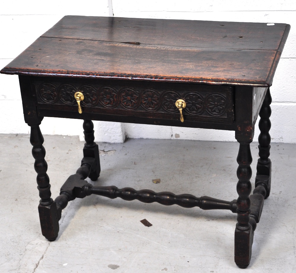 A late 17th early 18th century oak hall table,