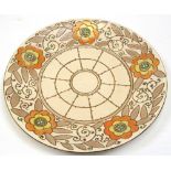 A Charlotte Rhead charger, decorated with sunflowers in yellow and orange, diameter 31cm.