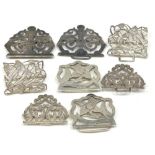 Four hallmarked silver nurses buckles to include two Art Noveau style examples, various hallmarks,