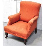 A Victorian mahogany arm chair, orange upholstery on front ring turned legs and castors.