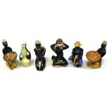 Six mid 20th century Drioli of Italy pottery liquor bottles in the form of African ladies (6).