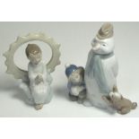 Two Nao figurines; "Winter Games", 18cm and "Jesus Loves You", 15cm, both with original boxes (2).