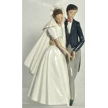 A Nao figure group depicting a married couple, height 28cm.