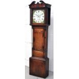 A 19th century oak longcase clock, the dial set with Roman numerals and bearing the name W.