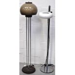 Two retro 1960s free standing lamps with chromed supports and glass shades, height 150cm.