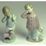 Two Nao figurines; "Sleepy Head, 19cm and "Boy on Phone with Puppets", 18cm,