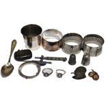 A mixed quantity of silver to include three napkin rings, a small vesta case, two thimbles,