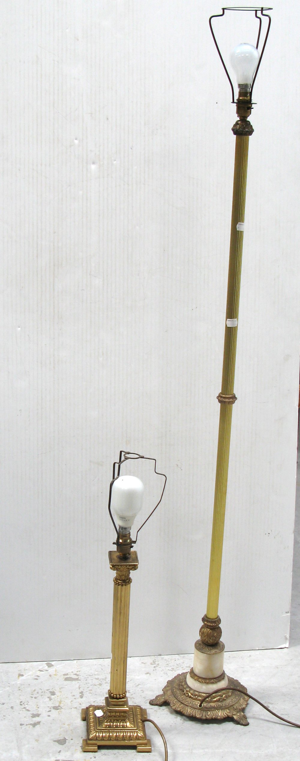 A brass column standard lamp on a fancy metal base and a matching brass  column table lamp (2).