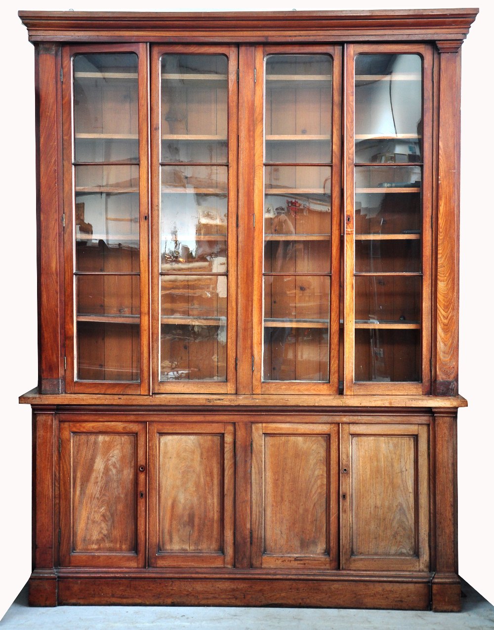 A large 19th century mahogany four door bookcase with glazed upper section,