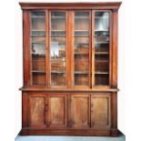 A large 19th century mahogany four door bookcase with glazed upper section,