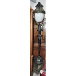 A Victorian painted cast iron free standing lamppost on a stepped stone base, height 240cm.