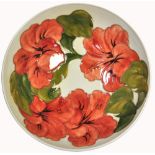 A Moorcroft cream ground Hibiscus pattern bowl,