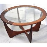 A retro circular G Plan glass topped coffee table, width 85cm.