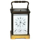 A good mid 20th century French brass carriage clock with Roman numerals and three subsidiary