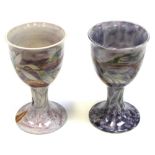 A matched pair of Corbridge goblets decorated with Magnolias and a Corbridge drip glaze baluster
