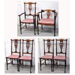 A matching set of six Edwardian mahogany and inlaid chairs to include a Captains style example,