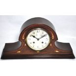 An early 20th century mahogany cased inlaid Napoleon hat chiming mantel clock,