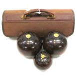 A cased set of vintage lignum vitae bowls by Jack Sharp of Liverpool.