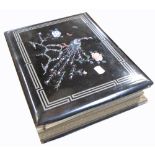 An early 20th century Japanese photograph album with hand painted silk lined pages (af).