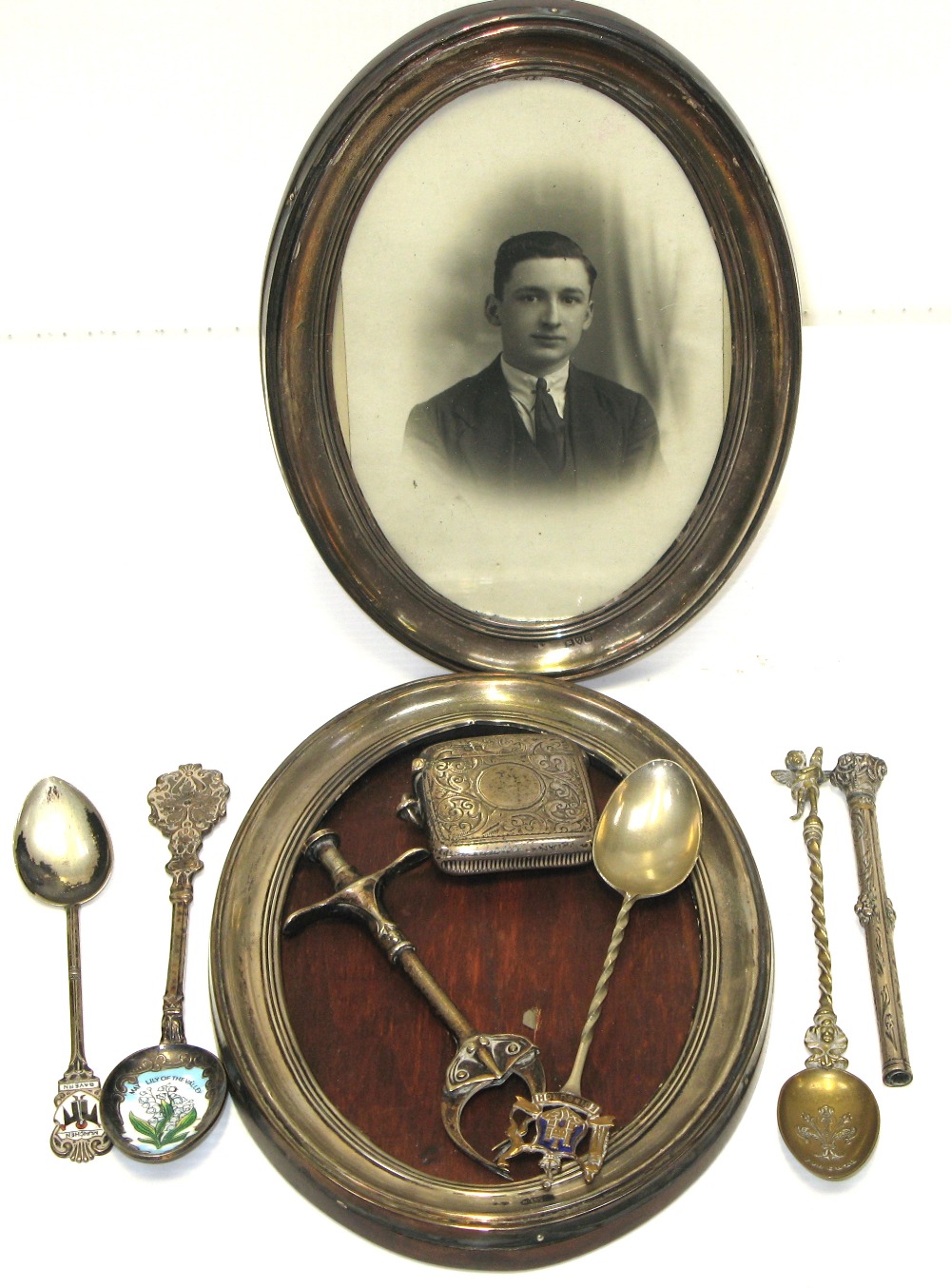 A hallmarked silver vesta case, two hallmarked silver picture frames,