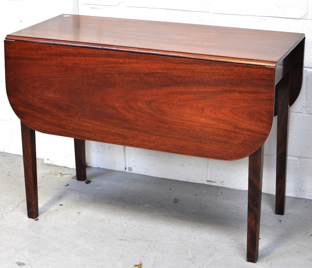 A early 20th century mahogany Pembroke table on square section supports, length 96cm.