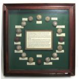 A glass display case documenting the history of golf balls and sixteen reproduction examples,