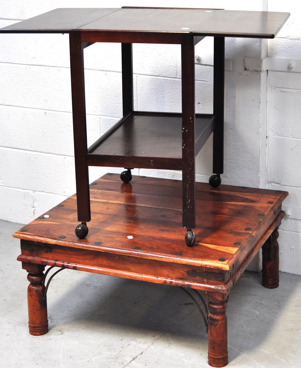 A mahogany tea trolley on castors and a modern coffee table (2).