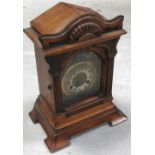 A late 19th century walnut Junghans mantel clock,