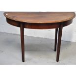 An early 19th century mahogany demi lune side table on tapering fluted supports, length 109cm.