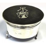 A hallmarked silver pique topped box of circular form on cabriole legs, hallmarks rubbed,