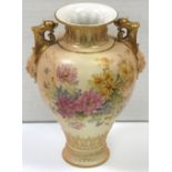 A Royal Worcester blush ivory twin handle baluster vase with  dolphin mask head decoration, hand