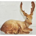 A Beswick model of a seated stag.