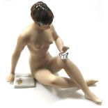 A Royal Dux nude figurine with butterfly,