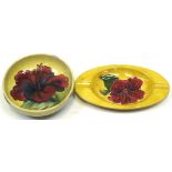 A Moorcroft Hibiscus yellow ground dish and a Moorcroft Hibiscus green ground bowl (2) (af).