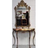 A metal gilded hall table with onyx top in the French style on cabriole legs with masque head