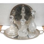Four cut glass and crystal decanters to include a Victorian example, all on a plated tray (5).