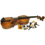 A late 19th early 20th century violin, lacking bow and case (af).