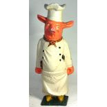 An early 20th century cast iron figure of a pig in chefs attire, height 60cm.