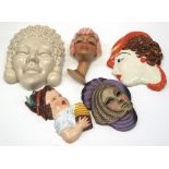 A small collectors lot to include face masks and wall pockets,