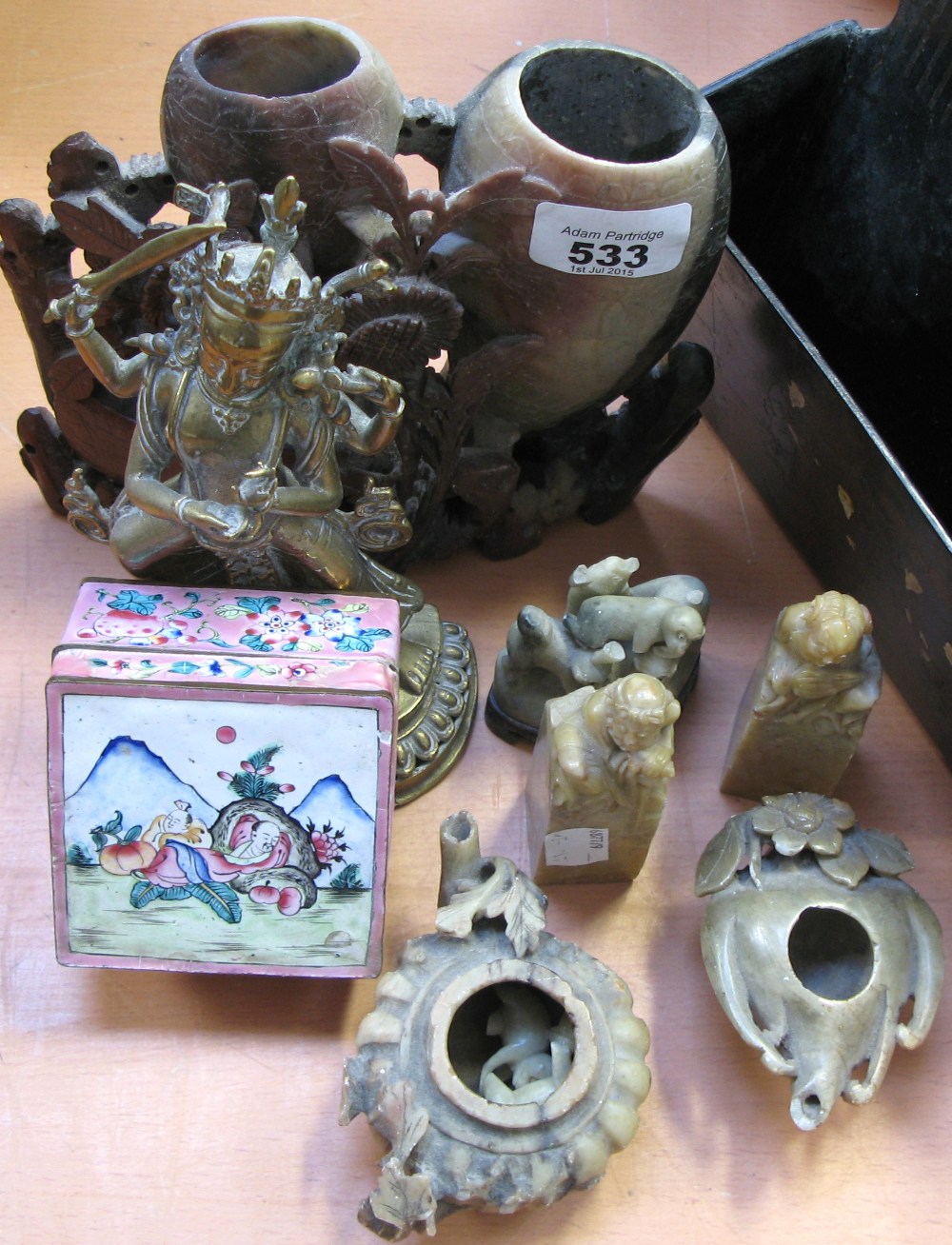 An Oriental collectors lot to include soapstone carvings, an Indian brass goddess figurine,
