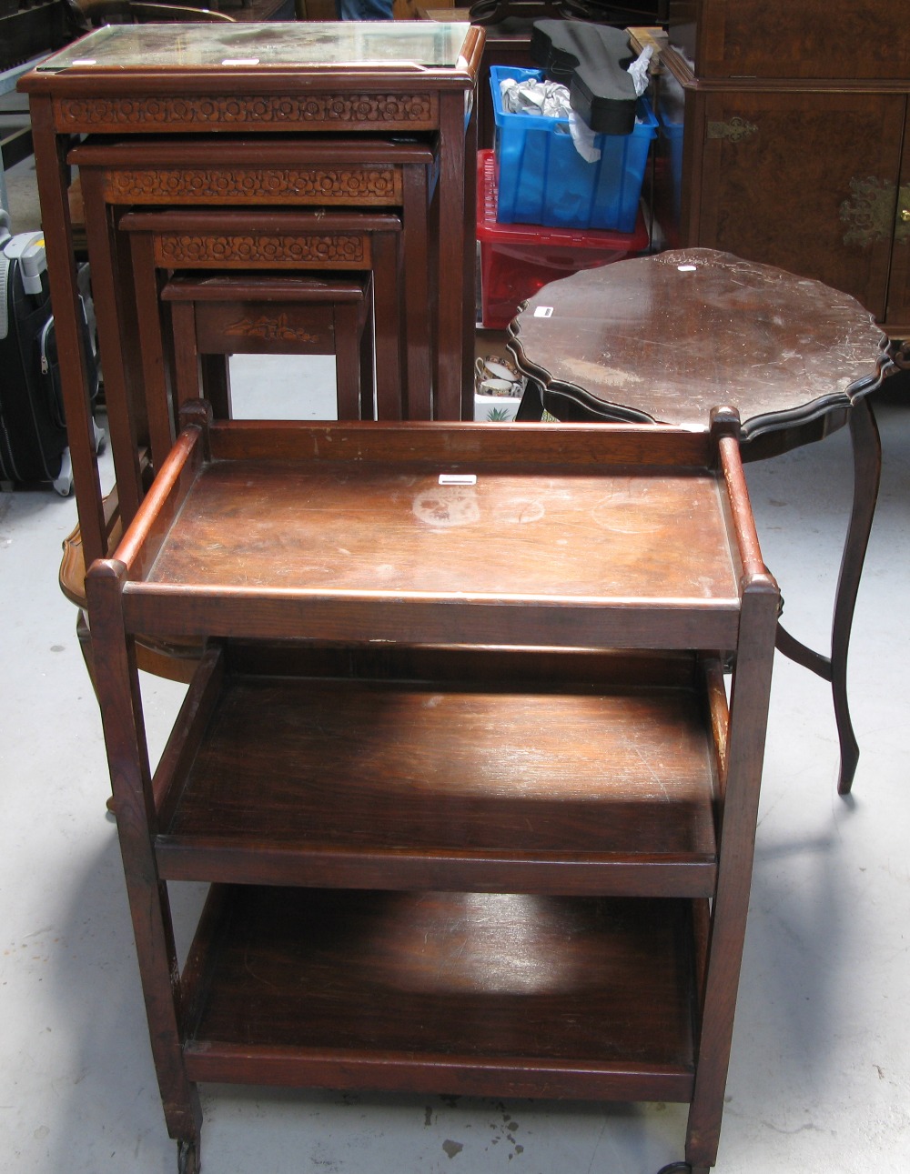 A reproduction nest of four tables in the oriental style,